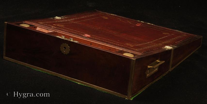 Regency brass edged mahogany writing box with  secret  drawers, by Thomas Lund of Cornhill, a replacement leather writing surface and compartments for pens and stationery. Circa 1820 Enlarge Picture